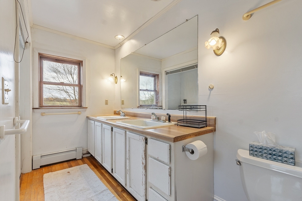 320 Old Ayer Road Groton, MA 01450 - Photo 34 of 42 a bathroom with a sink a vanity and a mirror