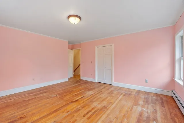 a bed room with a bed and window