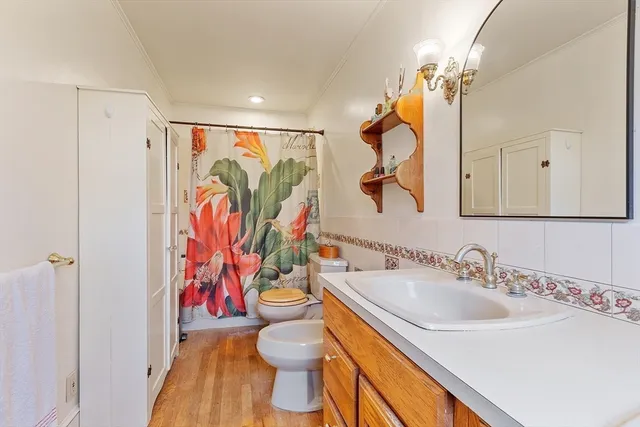 a bedroom with a large bed and a large window