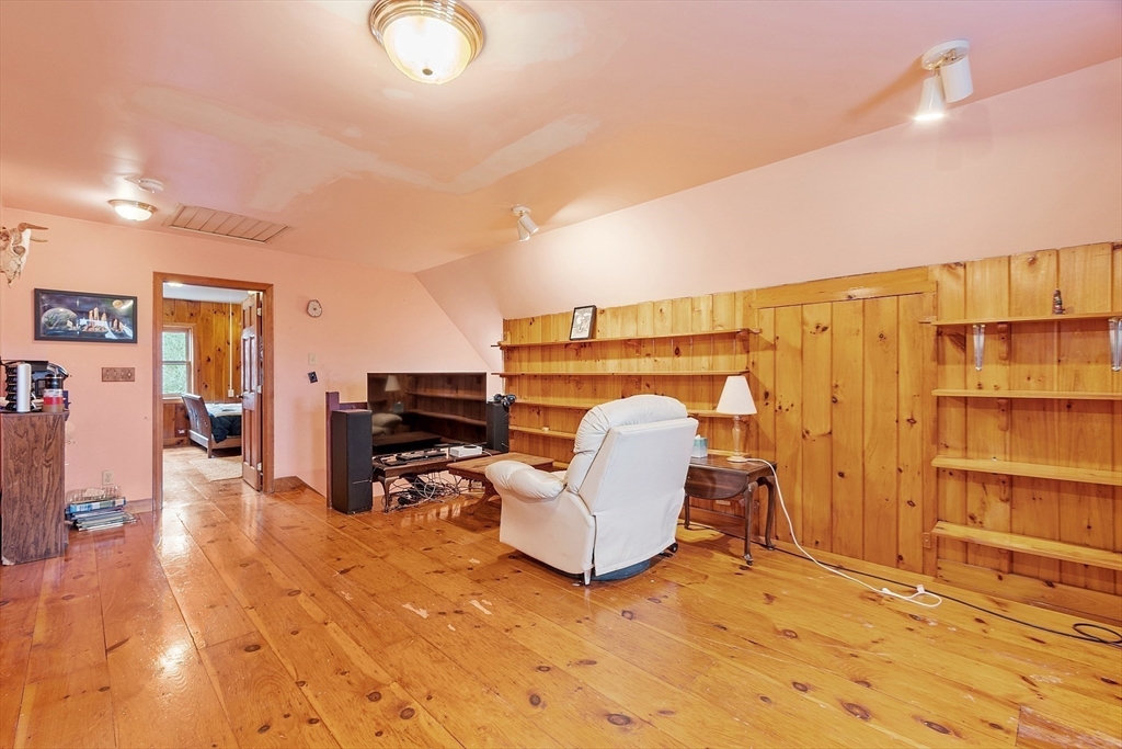 320 Old Ayer Road Groton, MA 01450 - Photo 40 of 42 a living room with a couch and piano table