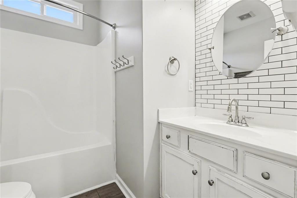 19 Safe Harbor Trail Dallas, GA 30157 - Photo 11 of 28 a bathroom with a sink and a mirror