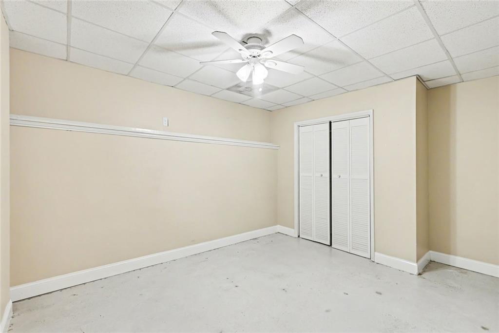 19 Safe Harbor Trail Dallas, GA 30157 - Photo 14 of 28 an empty room with chandelier fan and windows