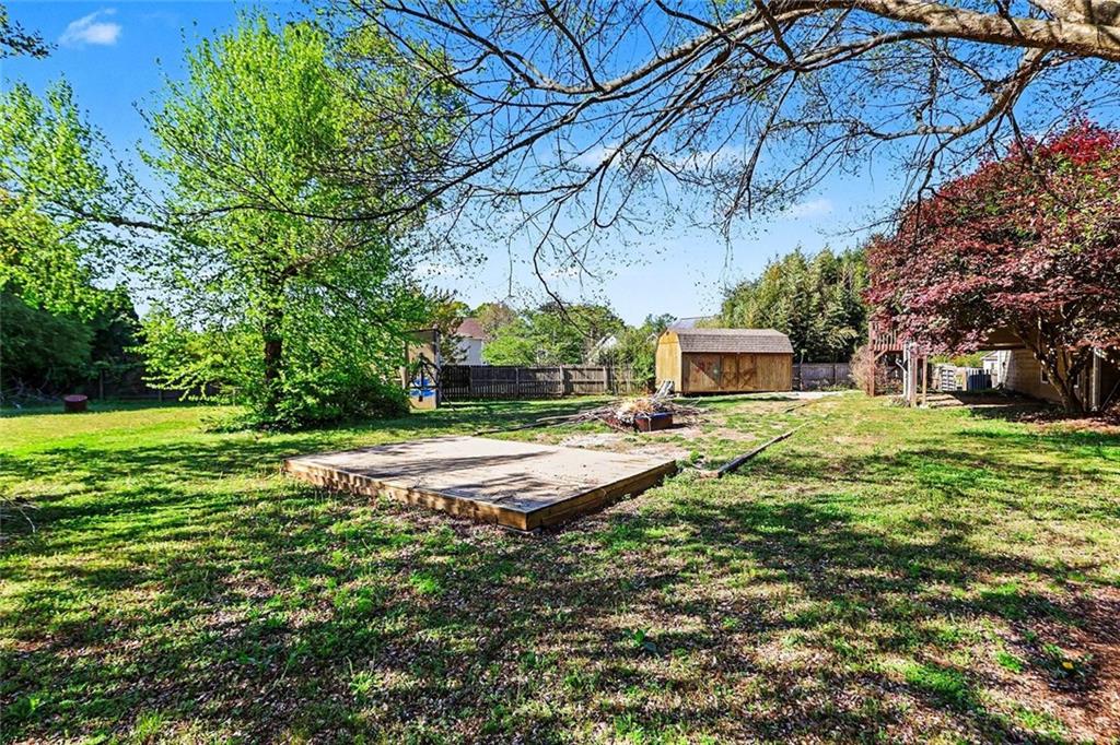 19 Safe Harbor Trail Dallas, GA 30157 - Photo 24 of 28 a front view of a house with garden