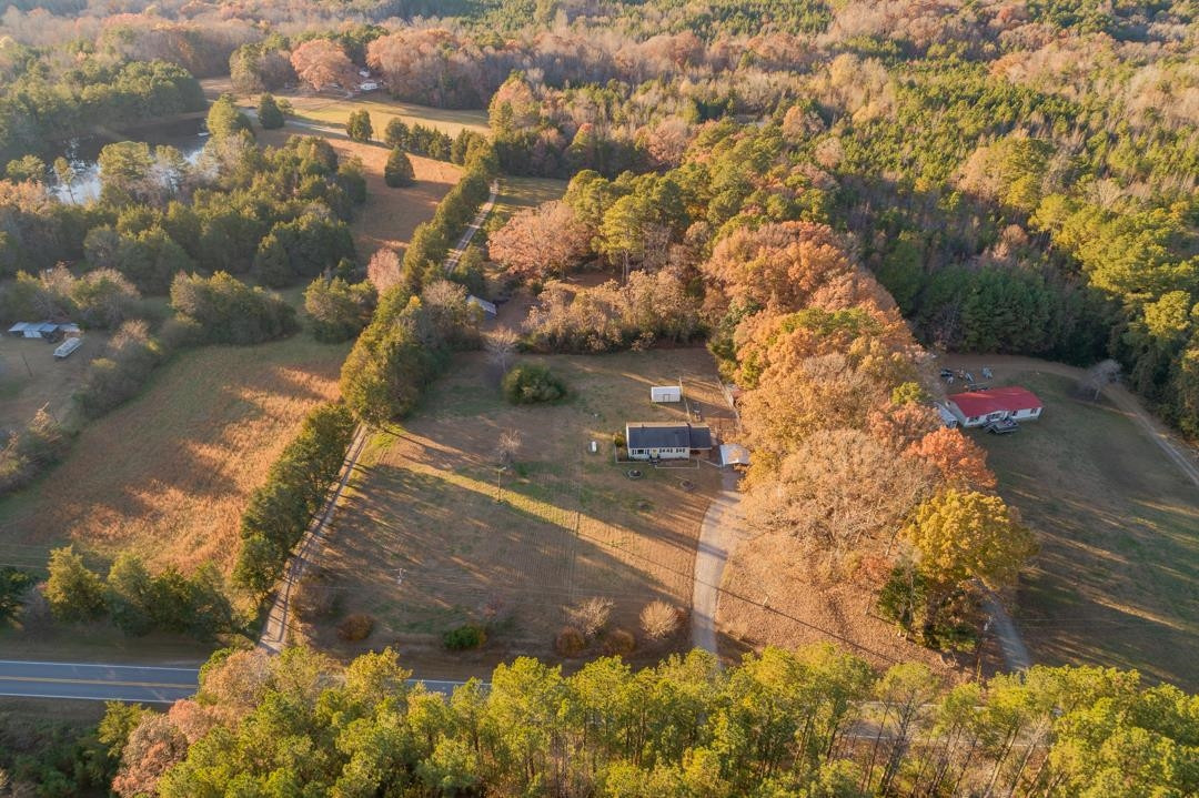 278 No Bottom Road Warrenton, NC 27589 - Photo 3 of 30 Frontage runs from the farm path on left to the far side of the large wooded area on right. Aerial view