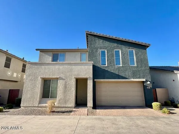 a front view of a house with a garage