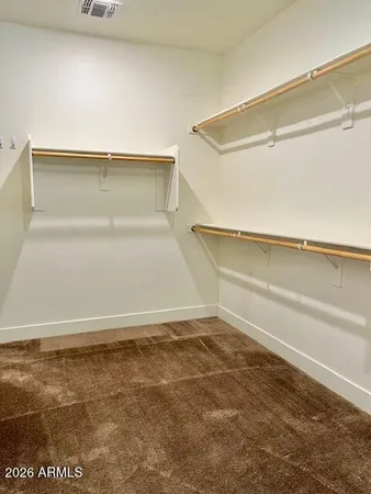 a view of an empty walk in closet