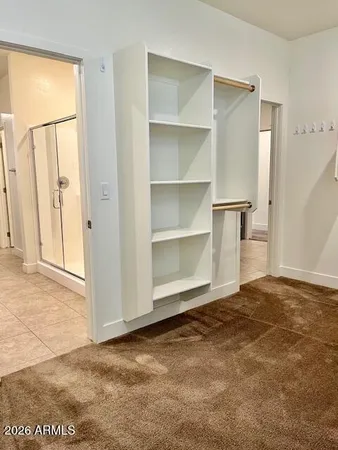 a view of an empty room with a closet