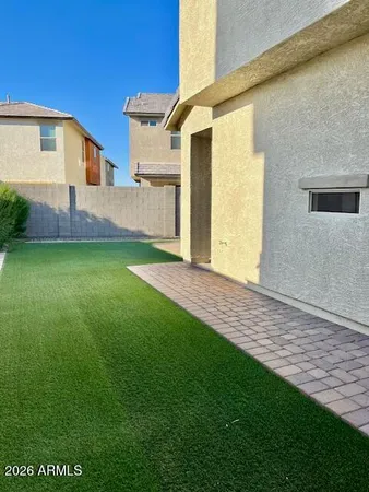 a view of a back yard of the house
