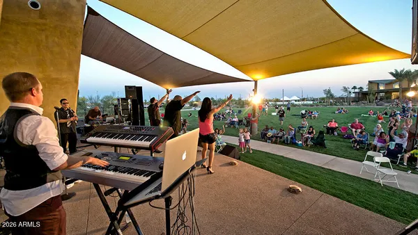 a view of a chairs and table in patio with a fire pit