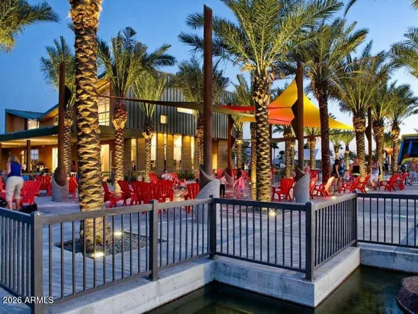 a group of people sitting in a yard