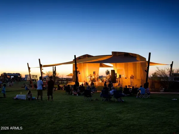 a view of a chairs and tables in the balcony