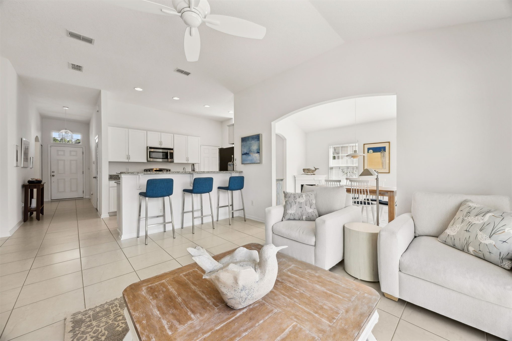 94037 Last Lane Yulee, FL 32097 - Photo 12 of 38 a living room with furniture a kitchen view and a kitchen view