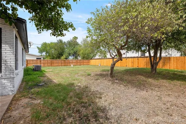 a view of outdoor space with trees all around
