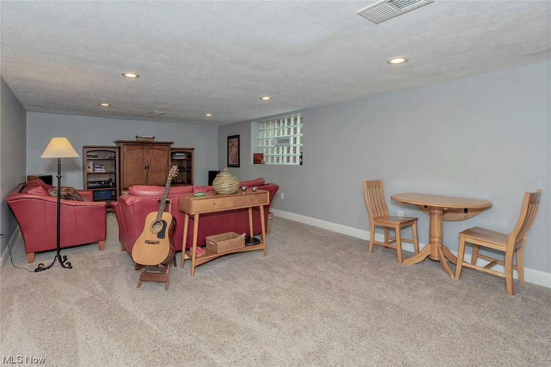 24101 Hazelmere Road Beachwood, OH 44122 - Photo 21 of 25 Large block windows keep this basement feeling open and bright.