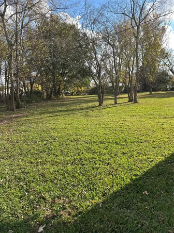 a view of outdoor space with trees all around
