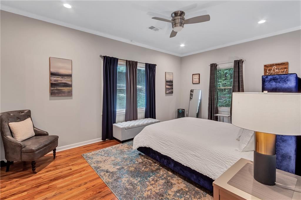 2418 Bolling Brook Drive Southwest Atlanta, GA 30311 - Photo 18 of 37 a bedroom with a bed and wooden floor