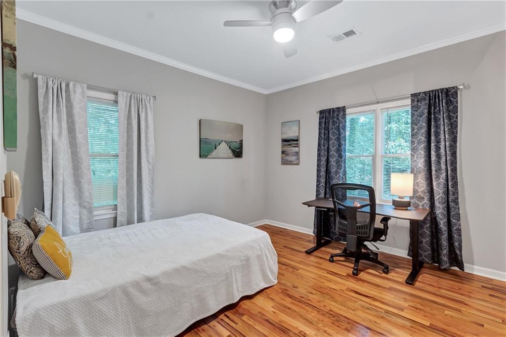 2418 Bolling Brook Drive Southwest Atlanta, GA 30311 - Photo 22 of 37 a bedroom with a bed and a large window