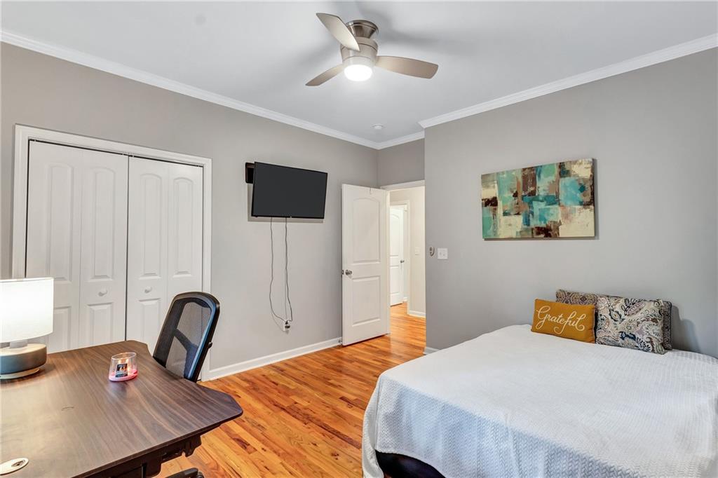 2418 Bolling Brook Drive Southwest Atlanta, GA 30311 - Photo 23 of 37 a bedroom with a bed large window and a flat screen tv
