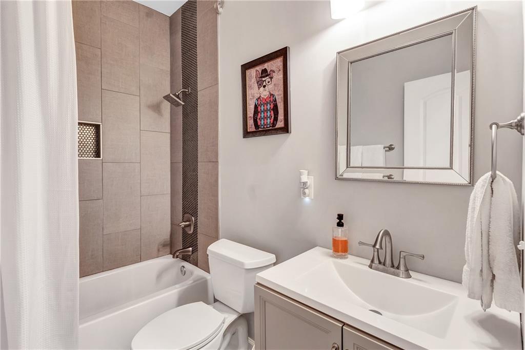 2418 Bolling Brook Drive Southwest Atlanta, GA 30311 - Photo 25 of 37 a bathroom with a sink toilet and shower
