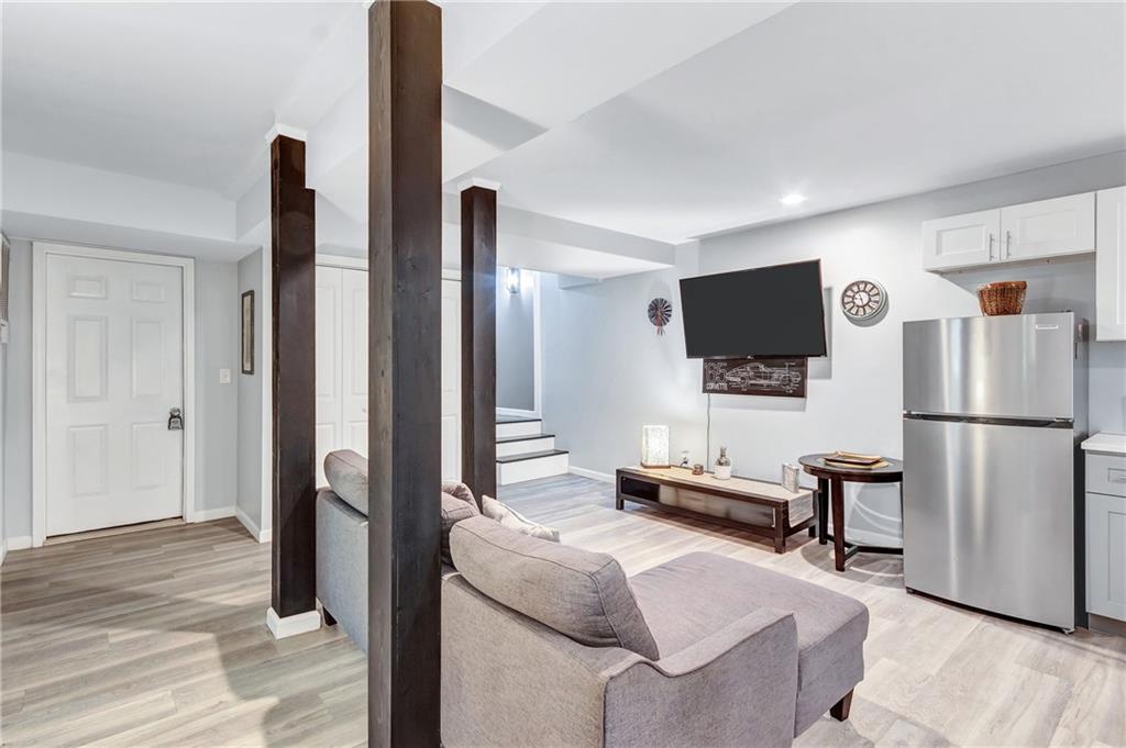 2418 Bolling Brook Drive Southwest Atlanta, GA 30311 - Photo 28 of 37 a bedroom with furniture and a flat screen tv