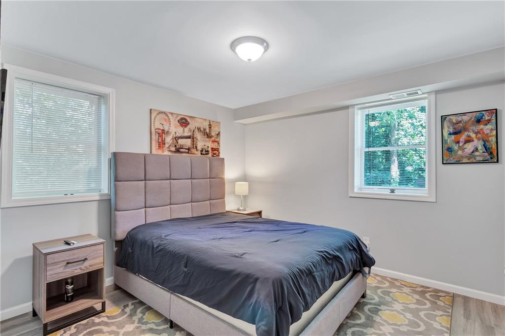 2418 Bolling Brook Drive Southwest Atlanta, GA 30311 - Photo 32 of 37 a bedroom with a bed and a window