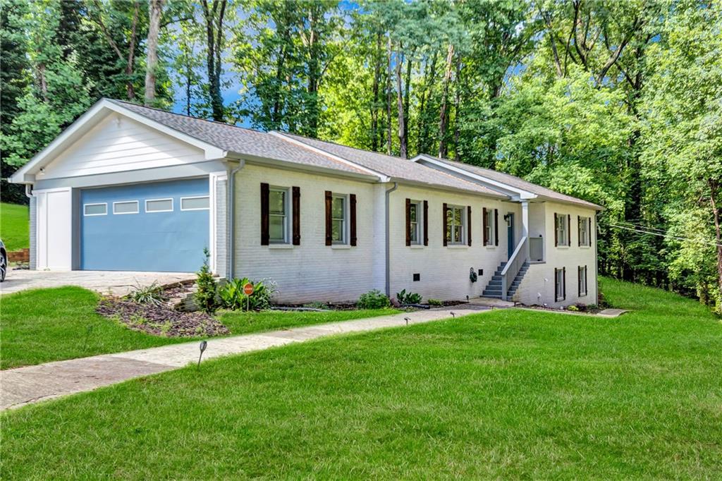 2418 Bolling Brook Drive Southwest Atlanta, GA 30311 - Photo 35 of 37 a view of a house with a yard and porch