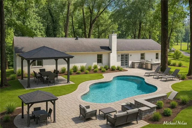 a view of a house with swimming pool and sitting area