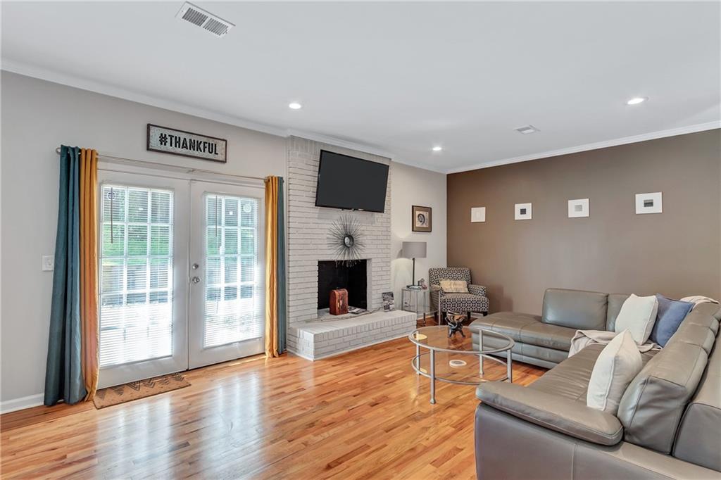 2418 Bolling Brook Drive Southwest Atlanta, GA 30311 - Photo 7 of 37 a living room with furniture and a fireplace