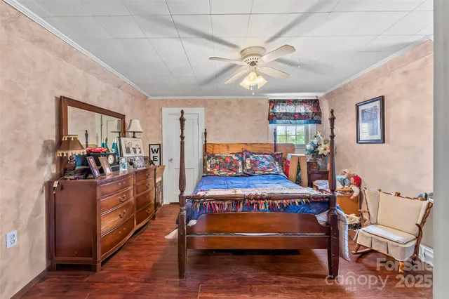 a view of a room with furniture and wooden floor