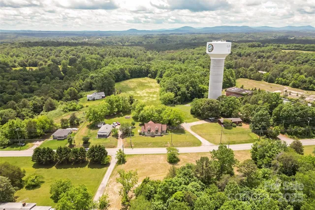a view of a garden with an ocean view