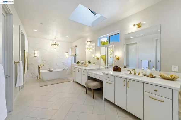 a bedroom with a bed and a ceiling fan