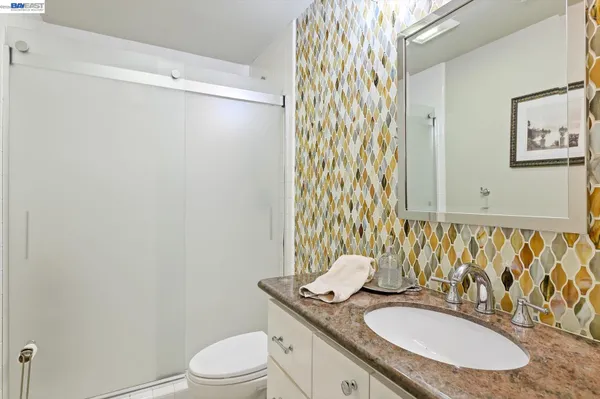 a view of workspace with wooden floor and cabinet