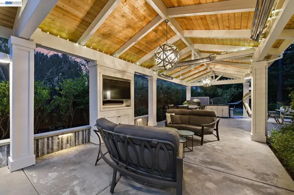 a view of a patio with table and chairs