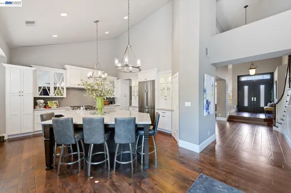a dining room with furniture and wooden floor