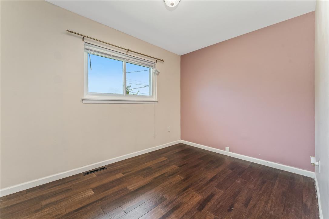 1331 Ridge Trail Easton, PA 18040 - Photo 13 of 22 Rich wood flooring adds warmth to this versatile room, featuring a large window that invites natural illumination.