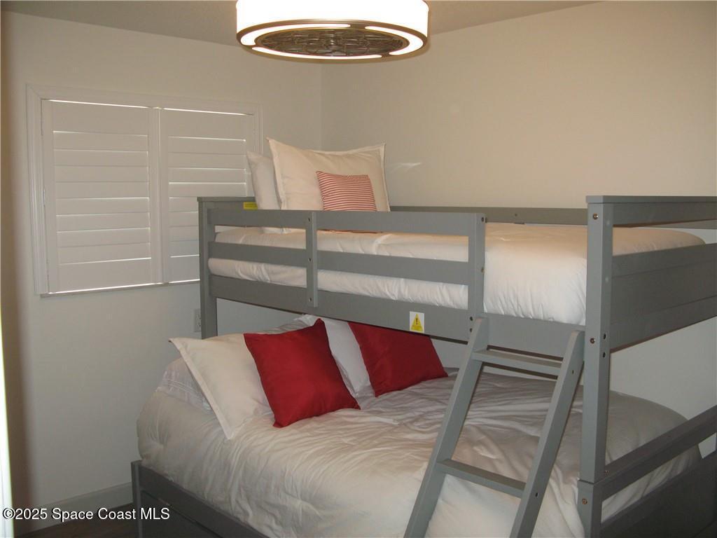 3700 Bay Street Sebastian, FL 32976 - Photo 20 of 34 a view of a bedroom with a wardrobe