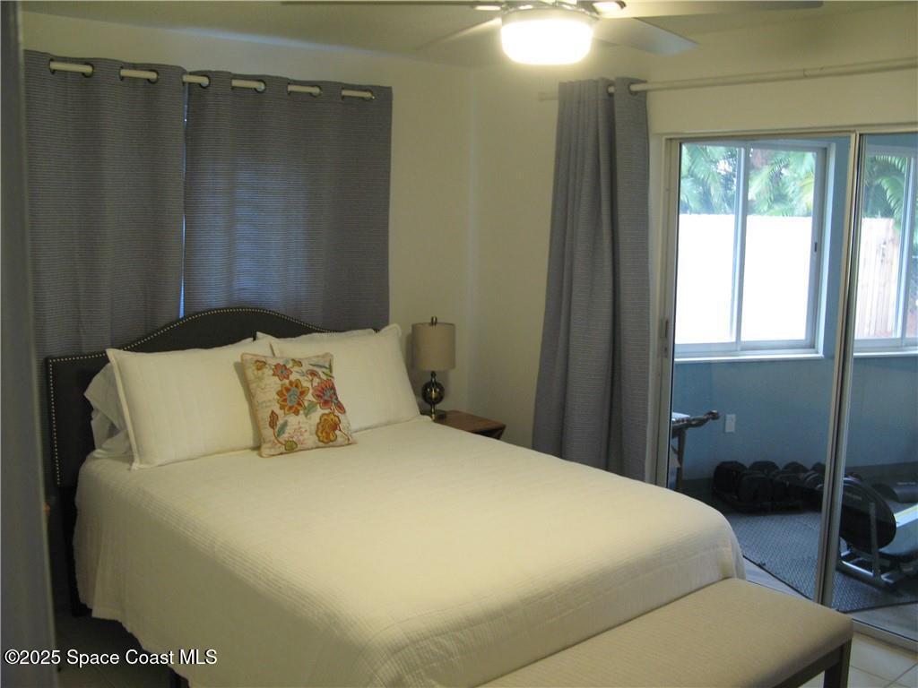 3700 Bay Street Sebastian, FL 32976 - Photo 24 of 34 a large bed sitting in a bedroom next to a window