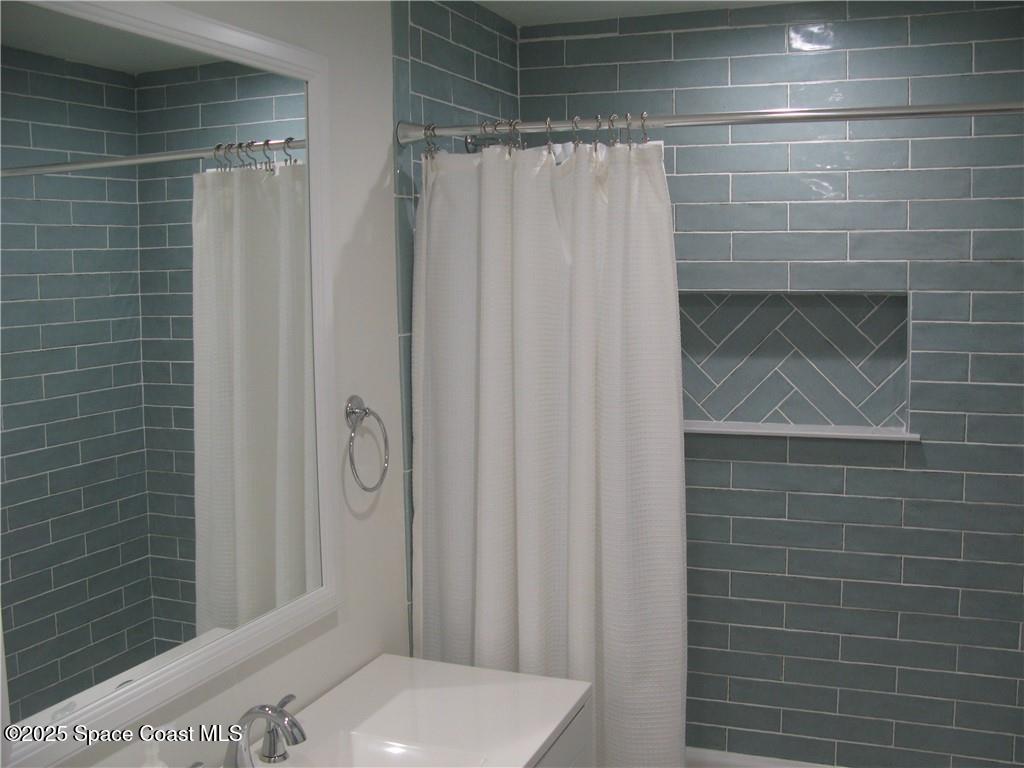 3700 Bay Street Sebastian, FL 32976 - Photo 26 of 34 a bathroom with a toilet and shower