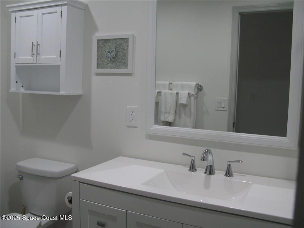 3700 Bay Street Sebastian, FL 32976 - Photo 27 of 34 a bathroom with a sink and a toilet