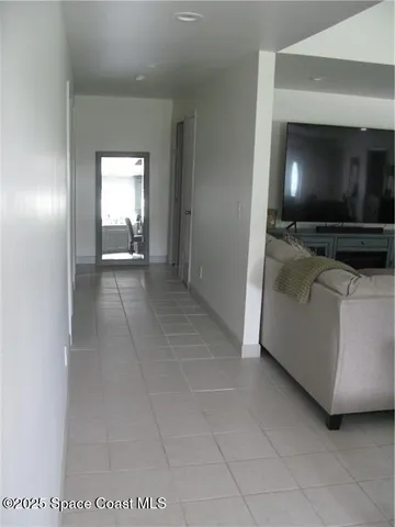 a living room with a flat screen tv and a fireplace