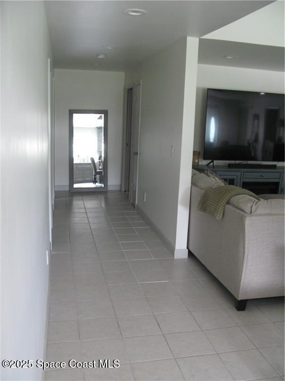 3700 Bay Street Sebastian, FL 32976 - Photo 28 of 34 a living room with a flat screen tv and a fireplace