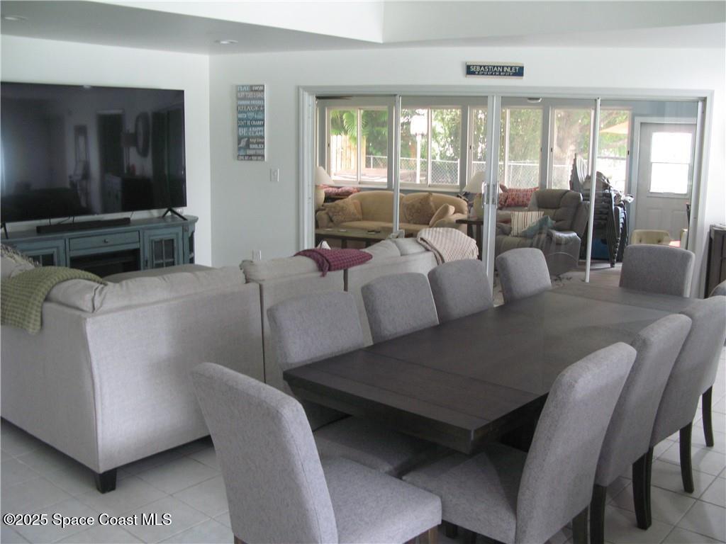 3700 Bay Street Sebastian, FL 32976 - Photo 3 of 34 a living room with furniture and large windows