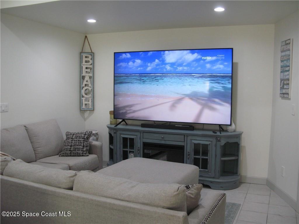 3700 Bay Street Sebastian, FL 32976 - Photo 6 of 34 a living room with furniture and a flat screen tv