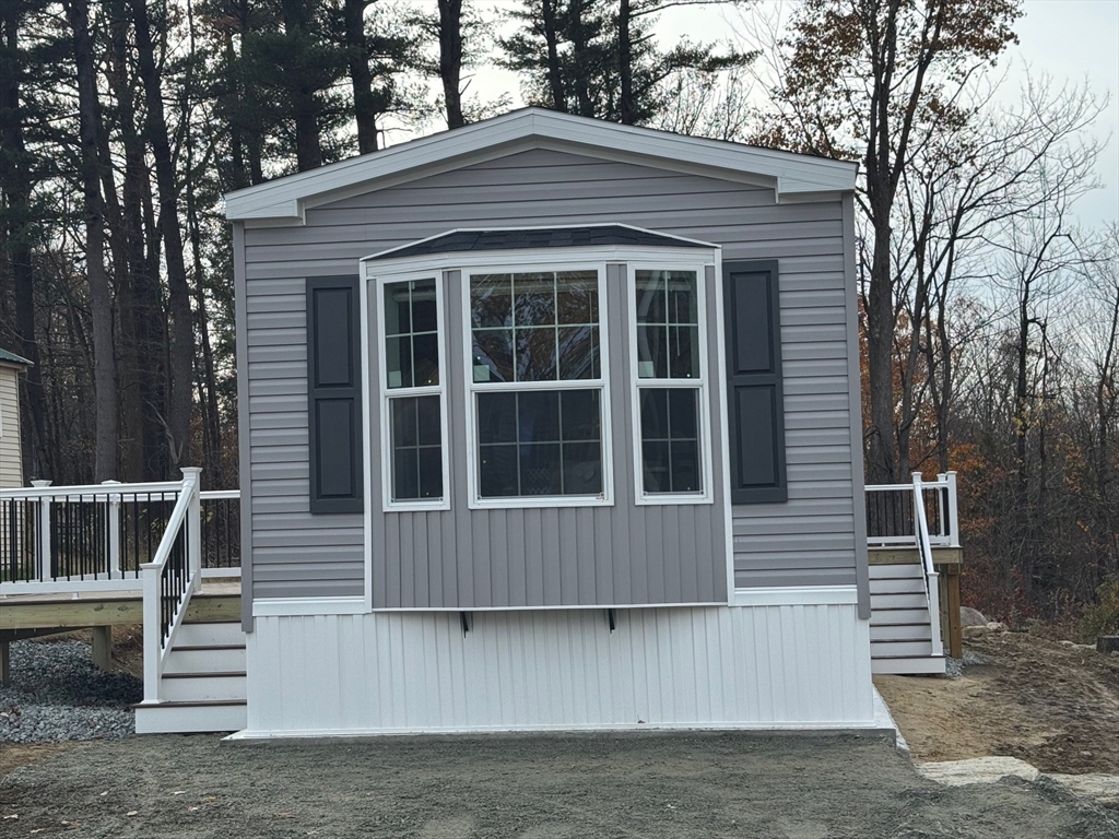 a view of house with outdoor space and porch