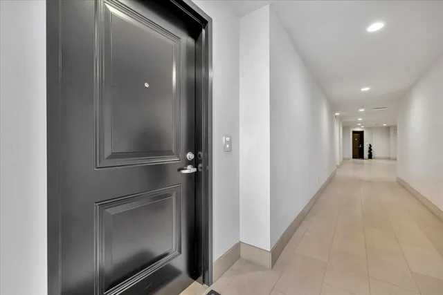 a view of an empty room and wooden floor
