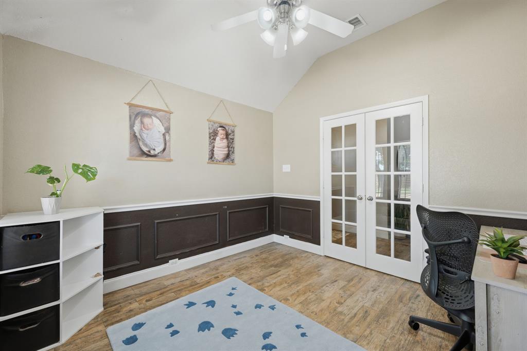 14152 Rodeo Daze Drive Fort Worth, TX 76052 - Photo 13 of 20 Vaulted ceiling room featuring French doors with multiple lites, wood-finish flooring, and a ceiling fan