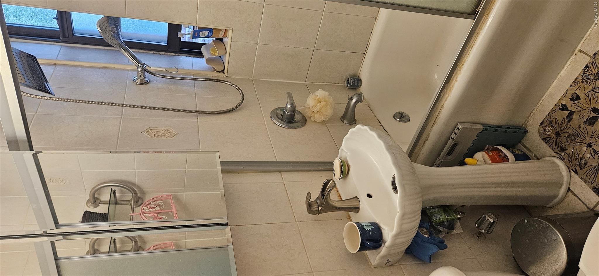 130 Bay Ridge Parkway, Unit 4E Brooklyn, NY 11209 - Photo 9 of 12 a bathroom with a sink and a mirror