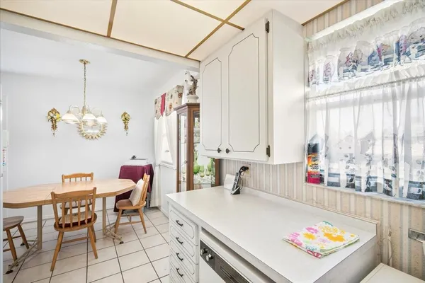 a living room with a table or chairs and a table