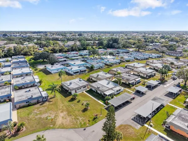an aerial view of residential houses with swimming pool