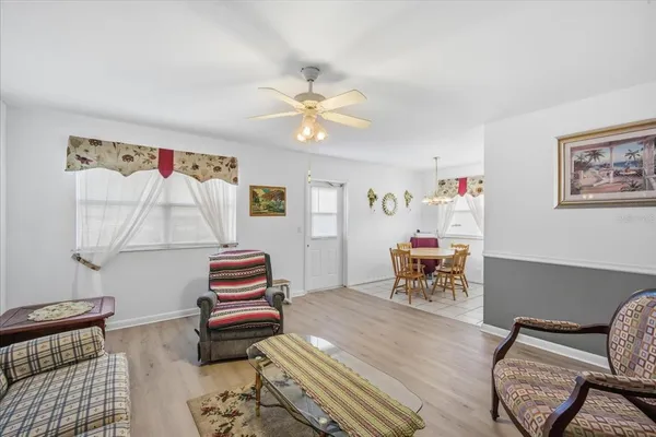 a bedroom with furniture and wooden floor